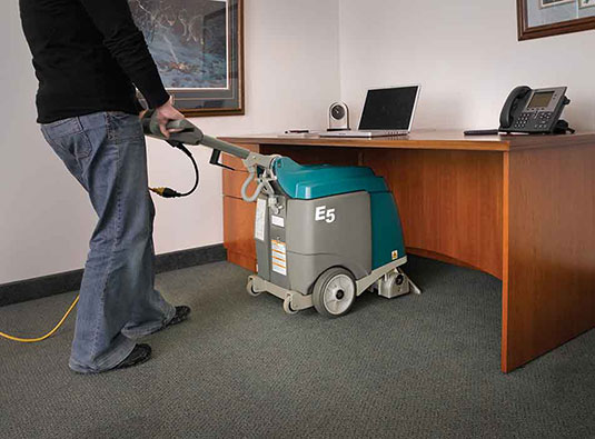 Tennant E5 Carpet Extractor Cleans under tables