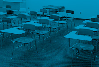grade school desk in clean facility classroom