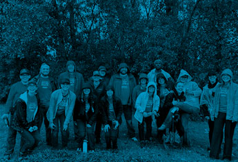 tennant employees posing for picture at tree planting event