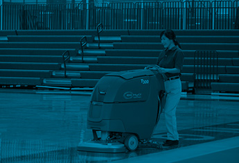 custodian/janitor cleaning school gymnasium