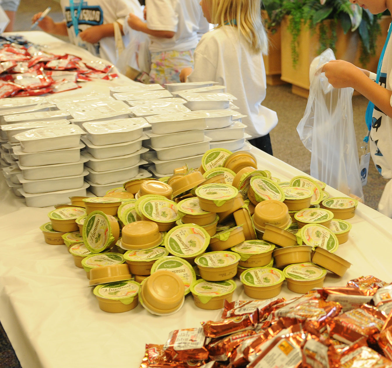 A volunteer packs food for The Food Group A volunteer packs food for The Food Group