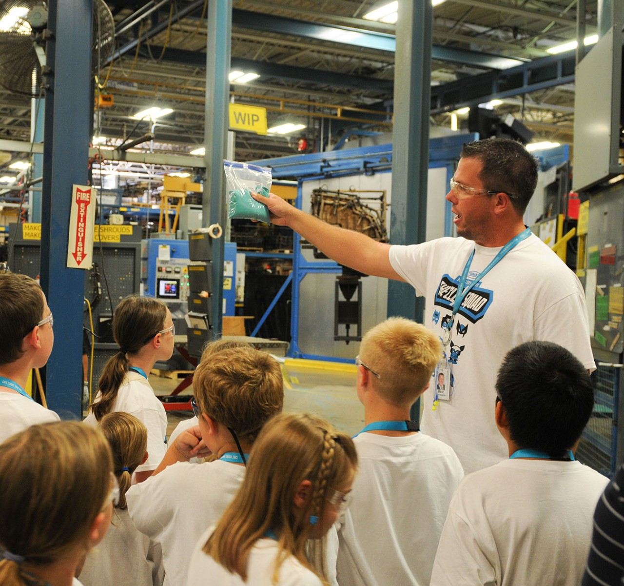 A Tennant employee giving a tour of the manufacturing plant. A Tennant employee giving a tour of the manufacturing plant.