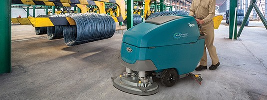 T600 Ride-On Scrubber in Industrial Setting - Metal Wire T600 Ride-On Scrubber in Industrial Setting - Metal Wire