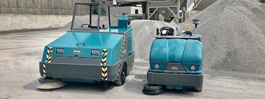 Tennant 800 and S20 Industrial Ride-On Sweepers at an concrete manufacturing facility Tennant 800 and S20 Industrial Ride-On Sweepers at an concrete manufacturing facility