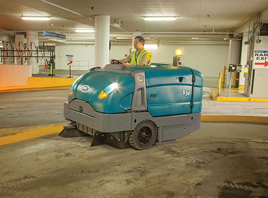 S30 Mid-Sized Rider Sweeper in a parking garage.