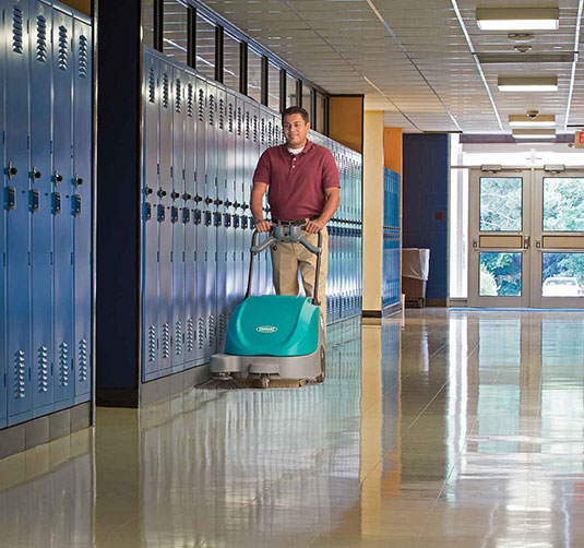 S5 Walk-Behind Sweeper cleaning in a school