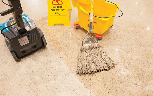 Tennant CS5 small walk behind floor scrubber versus a mop Tennant CS5 small walk behind floor scrubber versus a mop