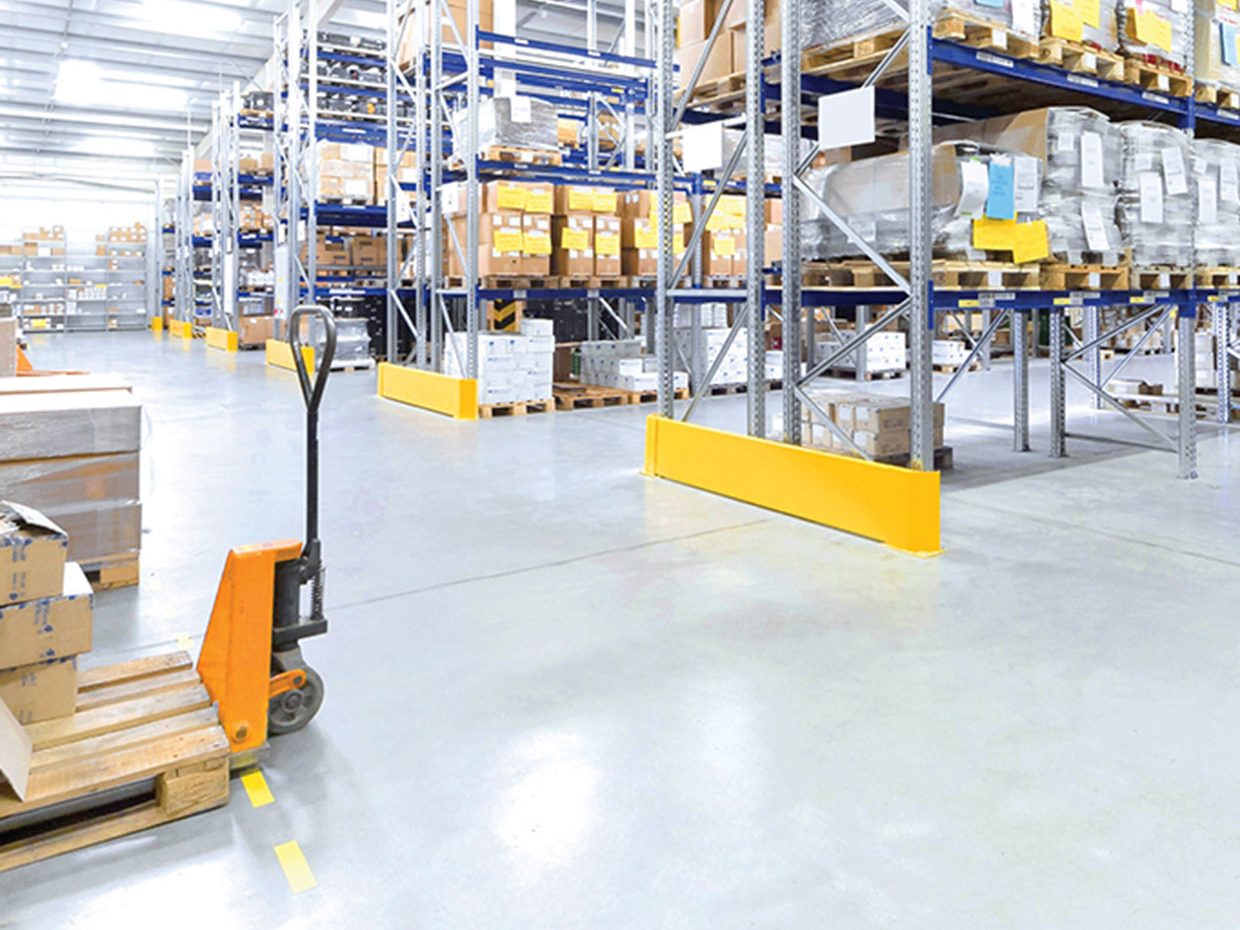 Shiny concrete floor in warehouse environment Shiny concrete floor in warehouse environment