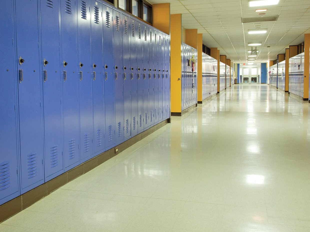 Newly restored floors welcome students in a school hallway Newly restored floors welcome students in a school hallway
