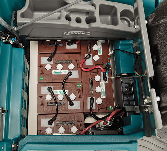 The battery array of a Tennant T16 Ride-On Auto Scrubber