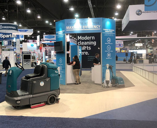 ISSA 2019 Tennant Tradeshow Booth with T7 AMR, iMop and floor scrubber displayed ISSA 2019 Tennant Tradeshow Booth with T7 AMR, iMop and floor scrubber displayed
