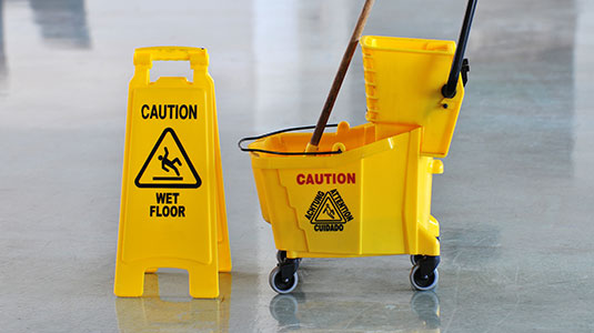 Wet floor sign on floor Wet floor sign on floor