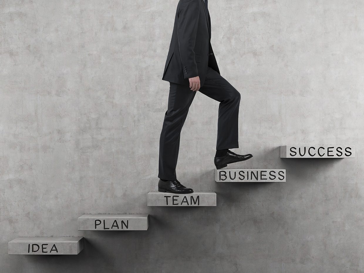 Business Person Walking Up Success Steps Business Person Walking Up Success Steps