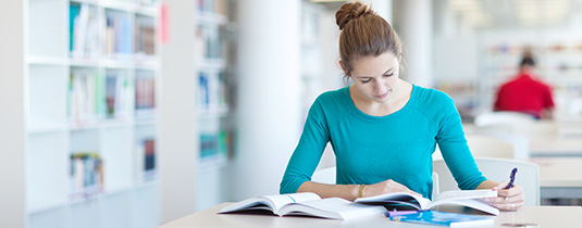 Studying in library image Studying in library image