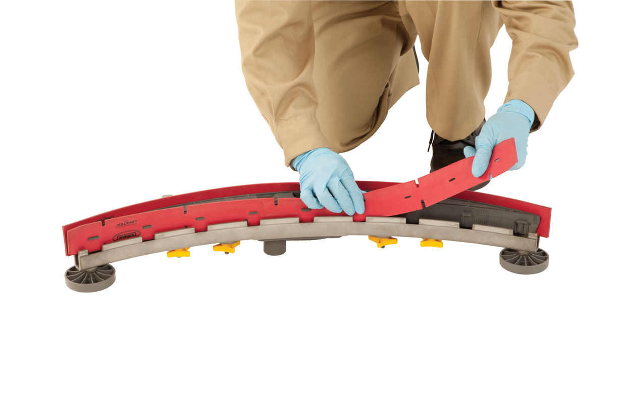 Person in gloves replacing squeegee Person in gloves replacing squeegee