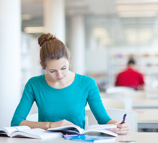 A student studies in a library. Cleaning in quiet areas can pose extra challenges. A student studies in a library. Cleaning in quiet areas can pose extra challenges.
