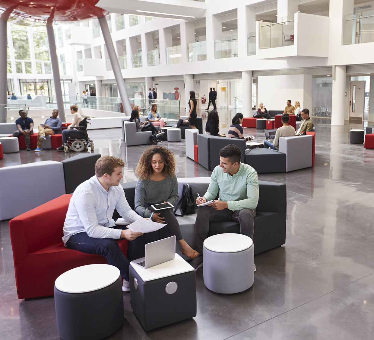 Students sitting in university atrium Students sitting in university atrium