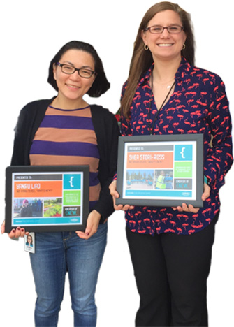 Tennant employees Yanru Liao and Shea Stori-Ross standing next to each other holding awards.