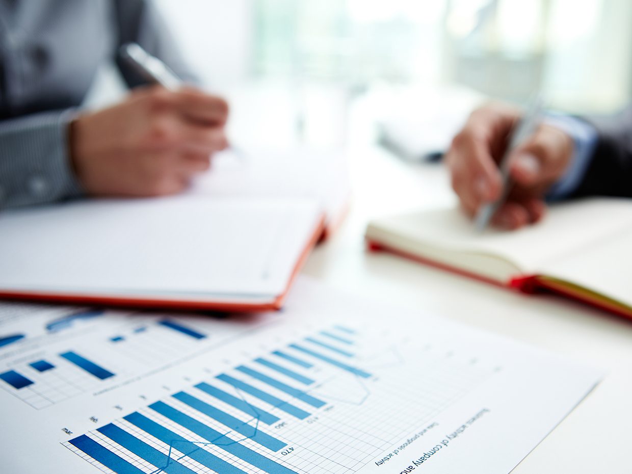 Managers reviewing spreadsheets