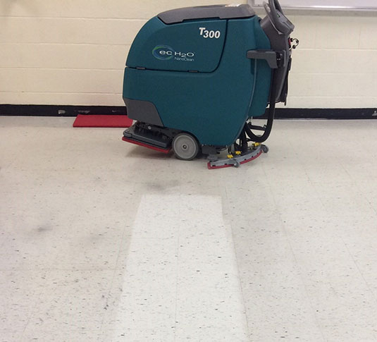 Floor finish removed using an orbital floor scrubber Floor finish removed using an orbital floor scrubber