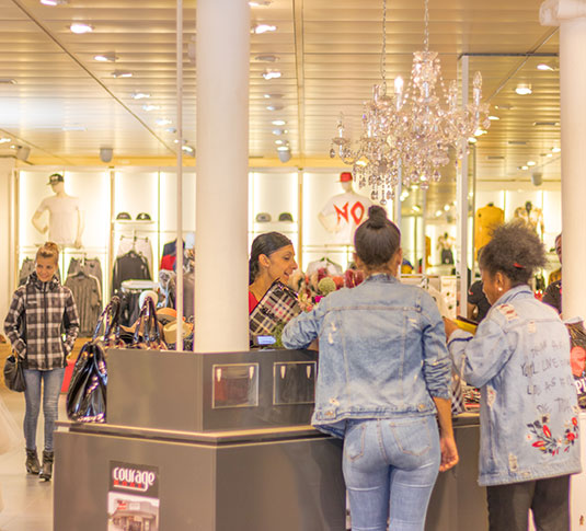 Shoppers checking out at retail store Shoppers checking out at retail store