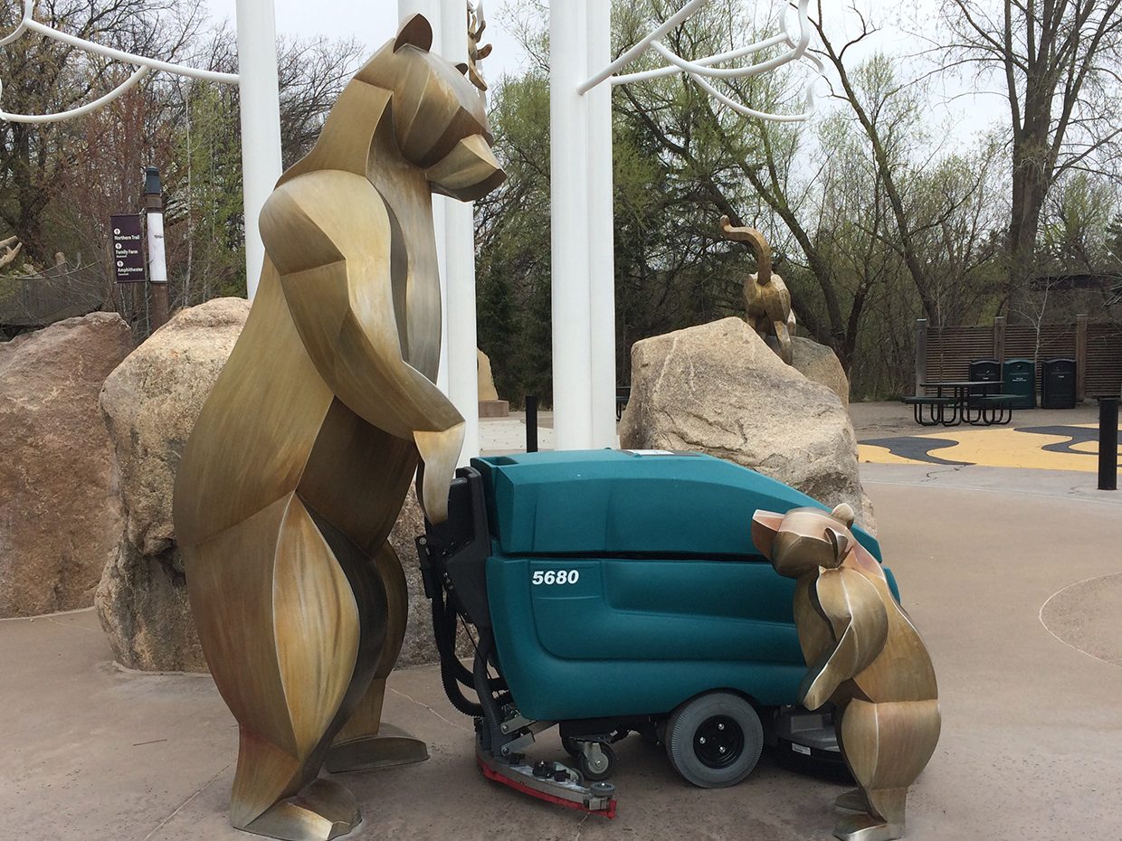 Bear statue at the zoo with walk-behind scrubber