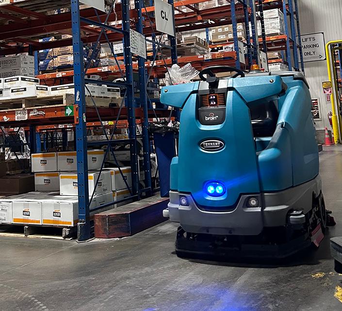 T16AMR Industrial Robotic Floor Scrubber cleaning in a warehouse