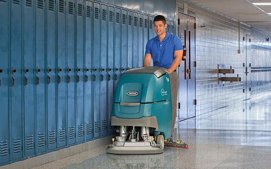 janitor cleaning school hallways during the summer janitor cleaning school hallways during the summer