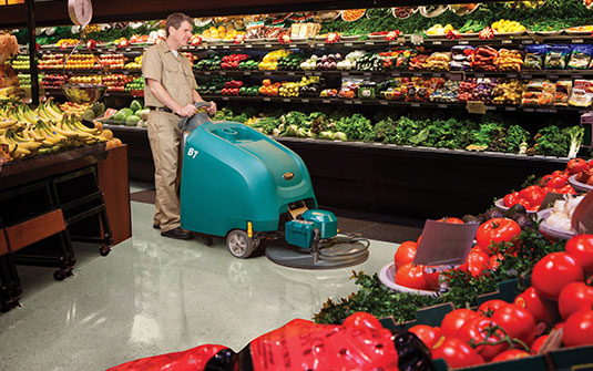Tennant burnisher cleaning a grocery store Tennant burnisher cleaning a grocery store
