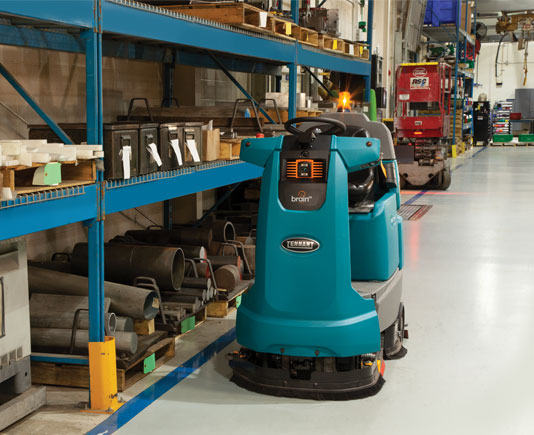 depiction of tennant t7amr robotic floor scrubber cleaning an industrial warehouse floor without an operator depiction of tennant t7amr robotic floor scrubber cleaning an industrial warehouse floor without an operator