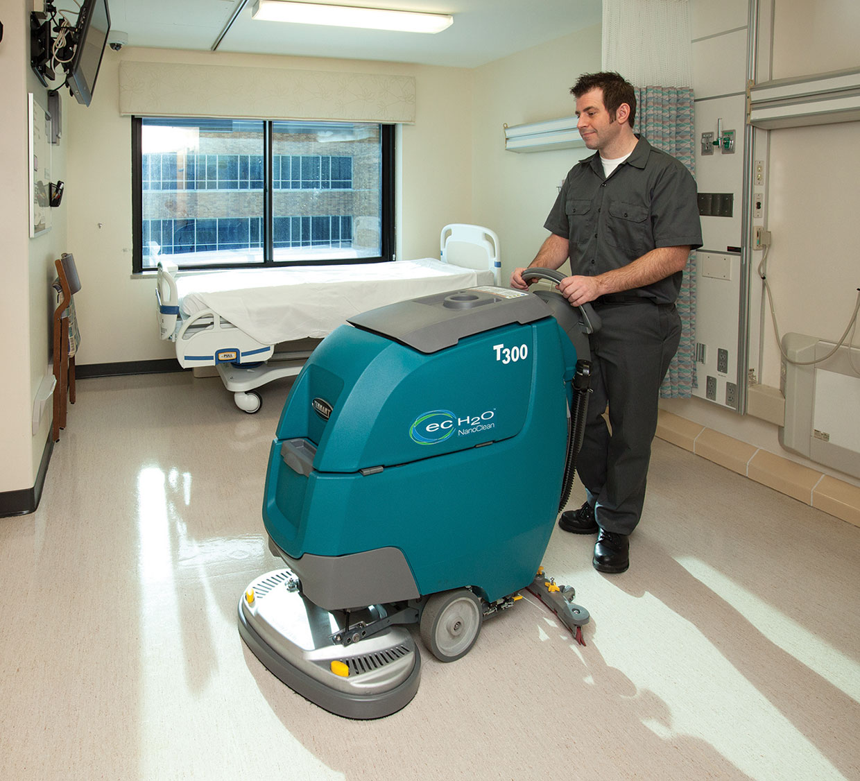 Cleaning a patient room with a scrubber Cleaning a patient room with a scrubber