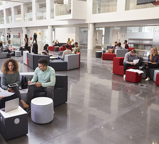 People work together in a public space. Sustainability initiatives can help increase attendance and satisfaction among a building’s occupants. People work together in a public space. Sustainability initiatives can help increase attendance and satisfaction among a building’s occupants.