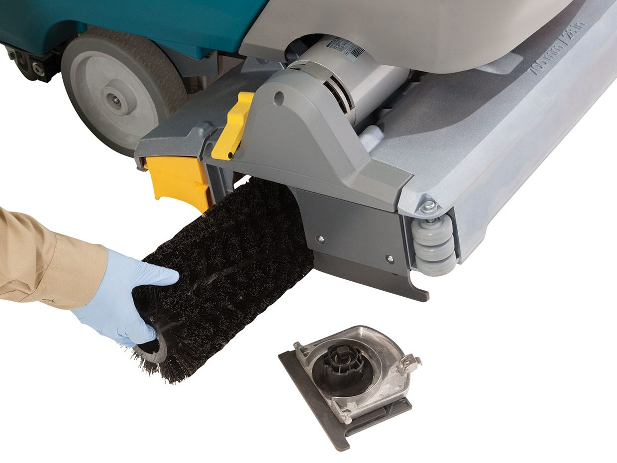 Technician changing a cylindrical brush Technician changing a cylindrical brush